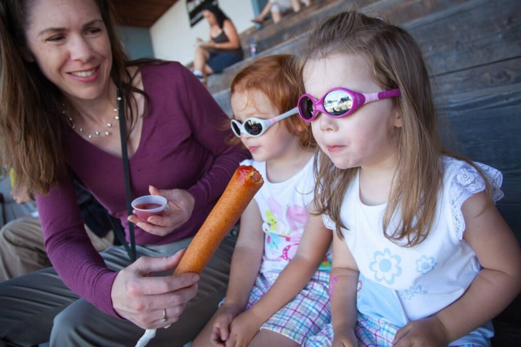 A family enjoying a solar eclipse with protective eyewear.