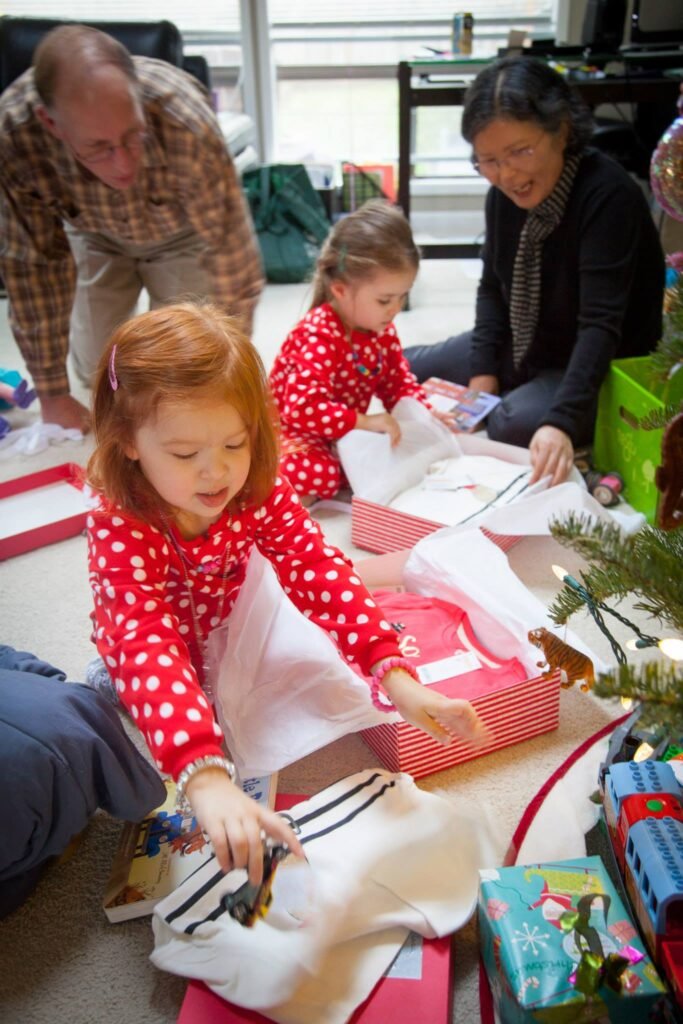 Children enjoy opening holiday gifts