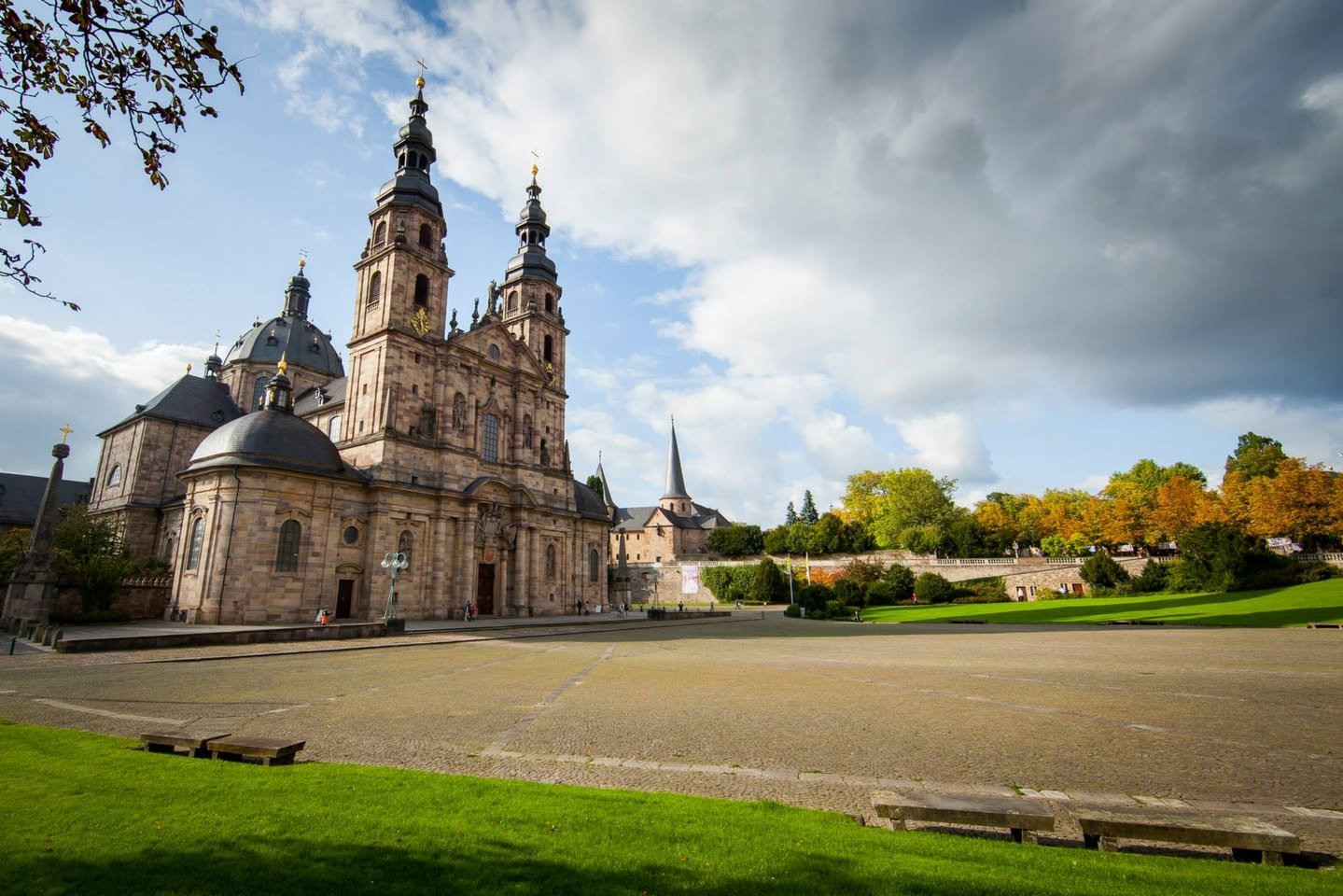 Fulda A stunning view of the Cathedral of St. Stephen in Pilsen, Czech Republic, showcasing its grand architecture against a backdrop of a dramatic sky.