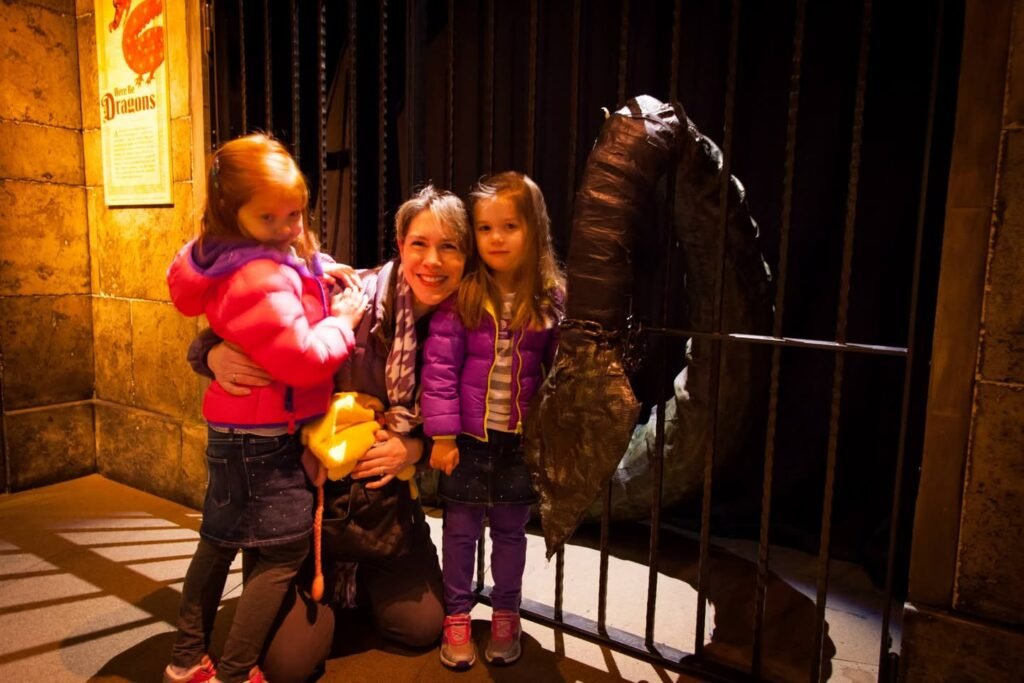 A family poses next to a large bird in an enclosure, highlighting an experience at the Woodland Park Zoo.