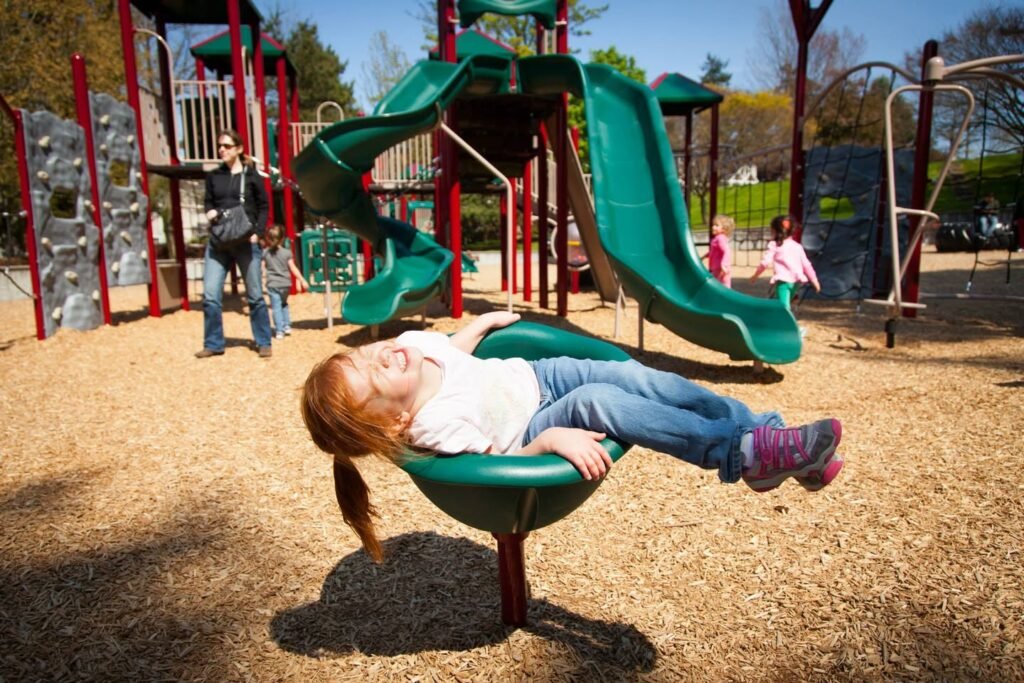 A collage showing a child relaxing on a swing set and other people enjoying play equipment at a local park.