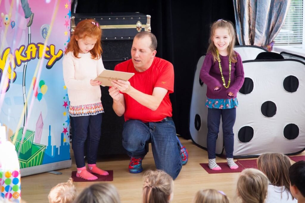 Family and friends gathered for a fun indoor gathering, featuring stage props and warm interactions.