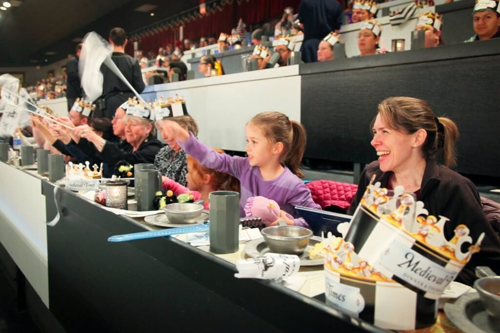 A family enjoys seating near the ringside at a professional boxing event in Las Vegas.