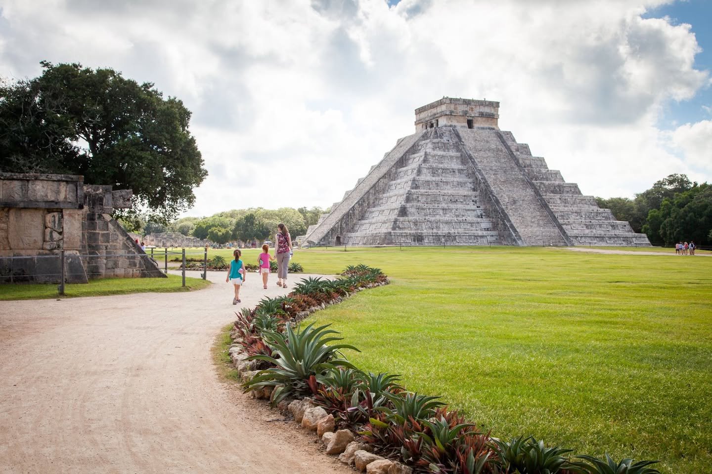 Chichen Itza Staircase and vast lawn at Chichen Itza. Classic shots of El Castillo under a cloudy sky.