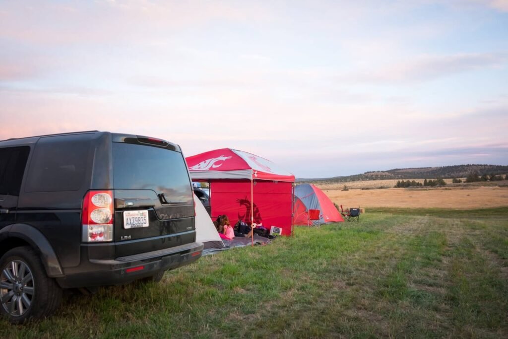 View of a vehicle parked near a red tent