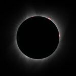 Eclipse Camping A series of photos capturing the total solar eclipse, showcasing the moon covering the sun and the corona's glow.