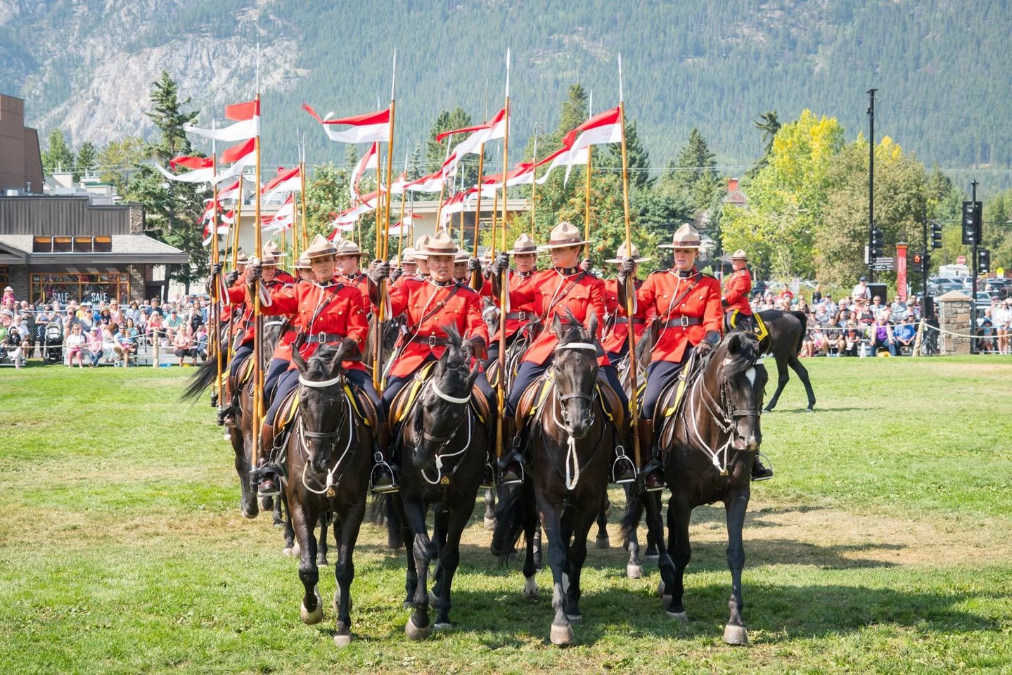 RCMP Musical Ride A mountie mounted on a horse in a red uniform.