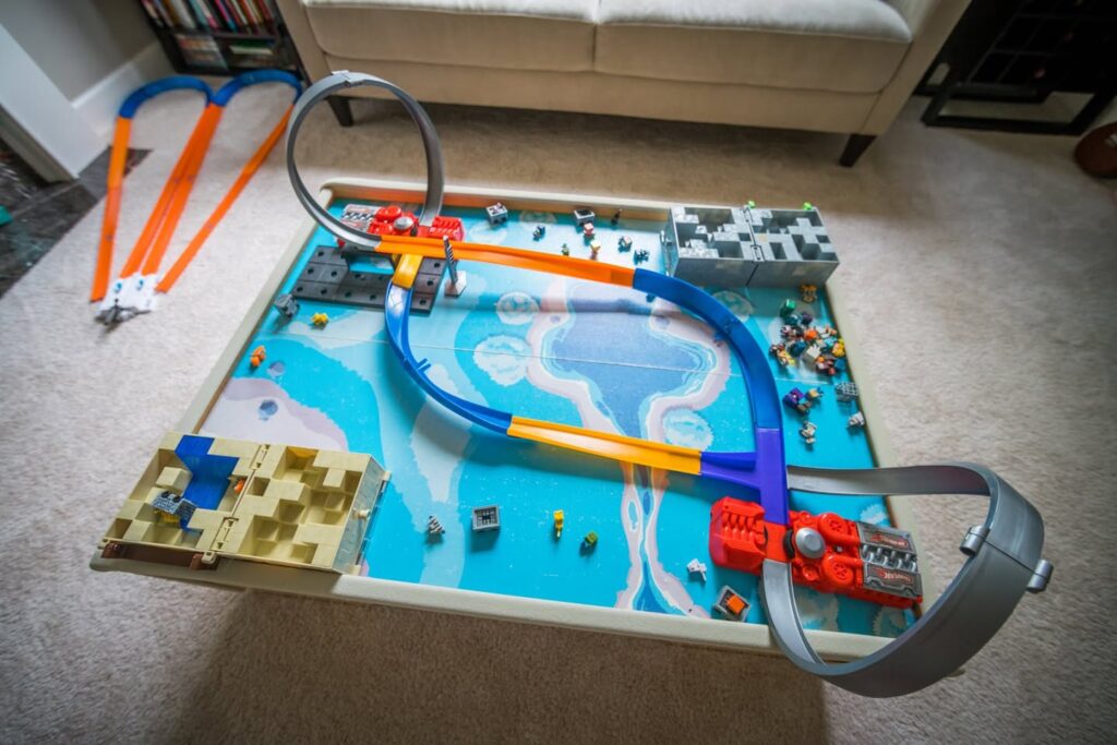 A detailed LEGO creation displayed in a home setting, featuring colorful tracks and pieces.