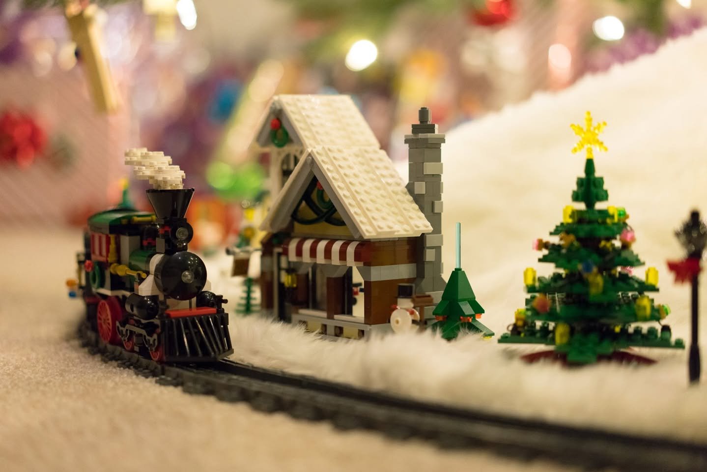 Christmas 2017 A charming LEGO Christmas train ride with a cozy snowy village and decorated trees.