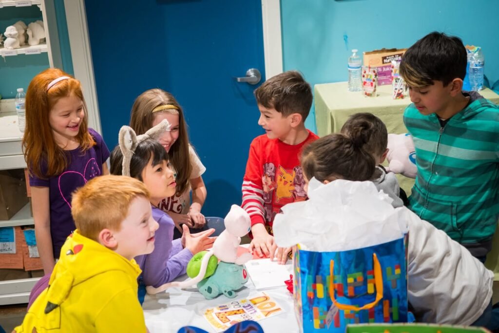 A family gathers around a table during an evening of board games and laughter. Multiple close-up photos show children smiling and interacting together.