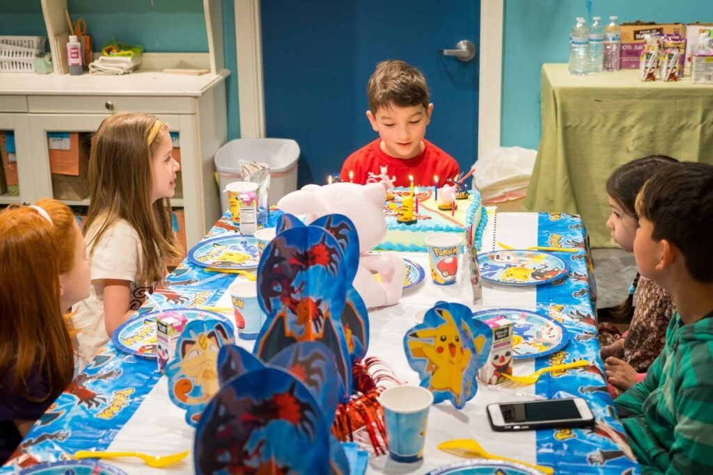 A group of children enjoying a colorful Spider-Man themed birthday party.