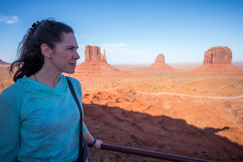 Capturing the iconic sandstone buttes of Monument Valley. A serene desert landscape under a clear blue sky.