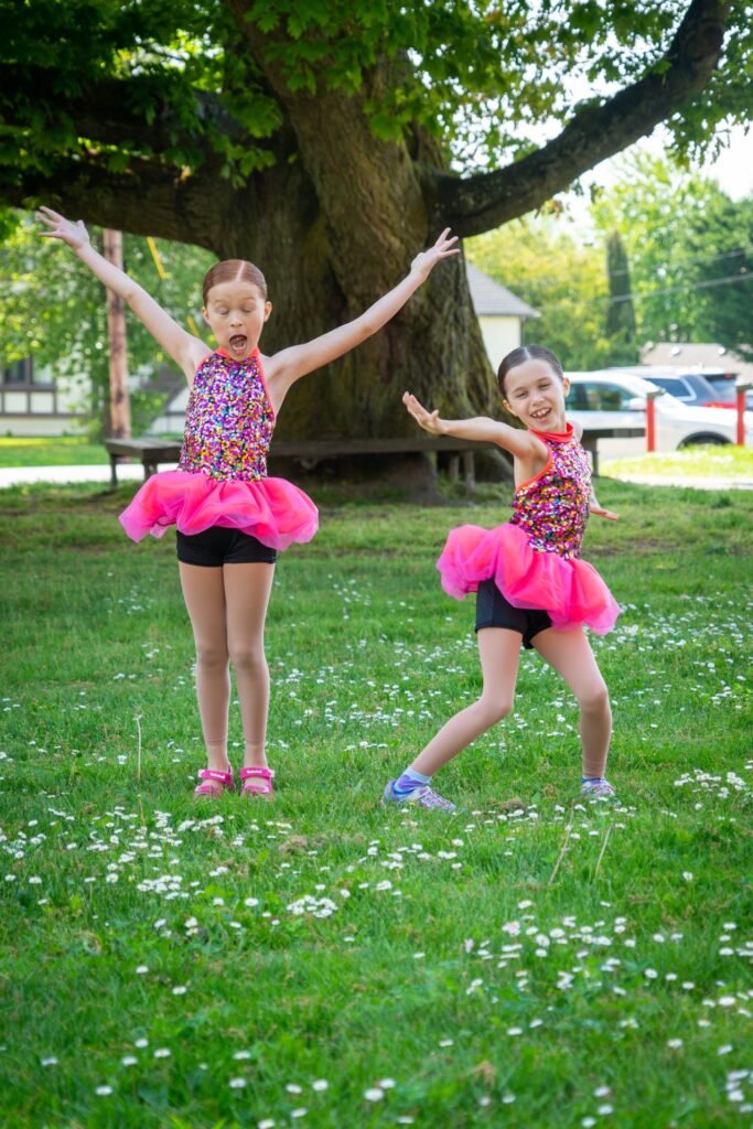Ballet performances in a park. Young dancers take bows after a show.