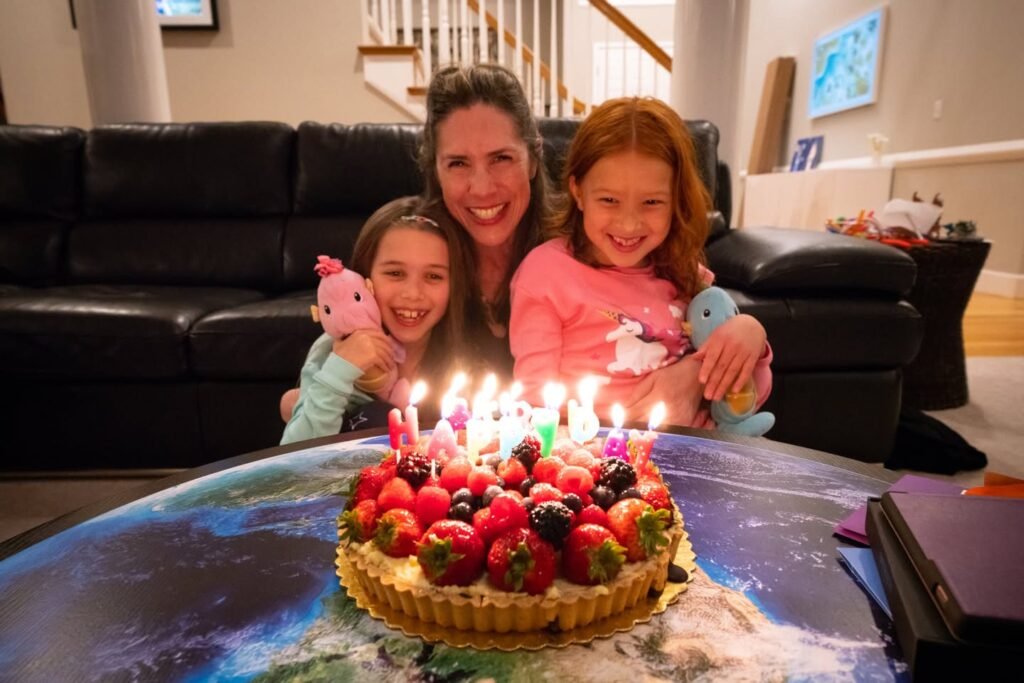 Family Celebrates Birthday With Decorative Cake