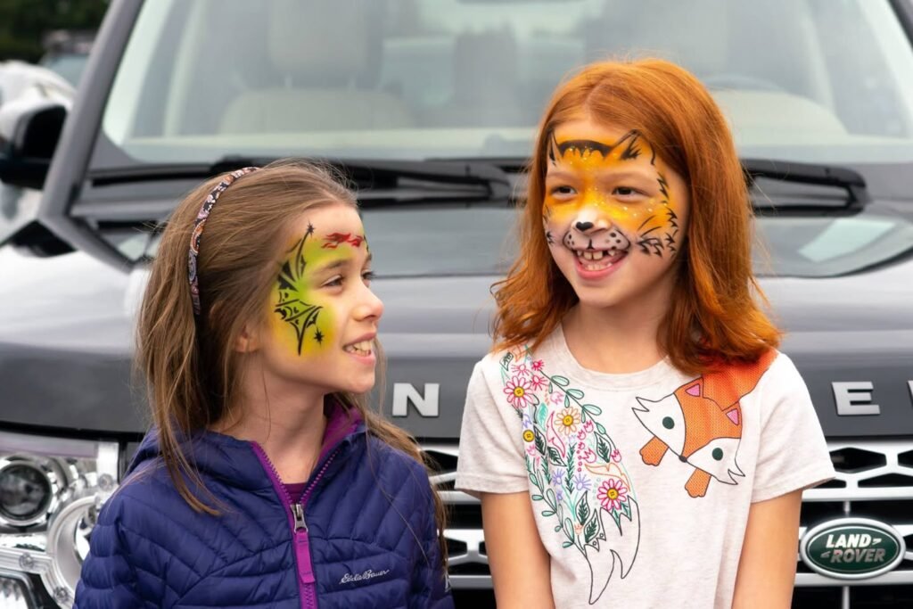 Two kids with colorful face paint