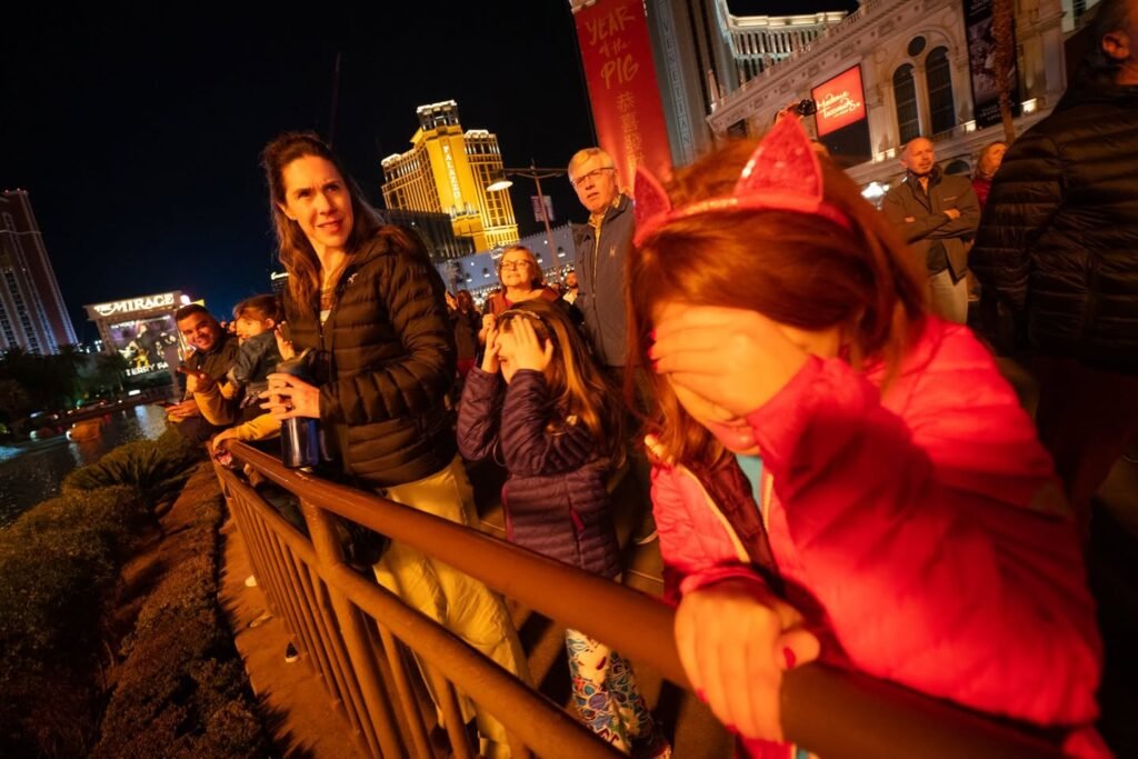 A user enjoys a captivating night view from a Las Vegas riverboat.
