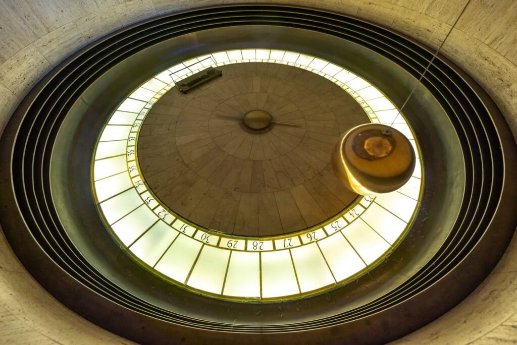A stunning circular skylight with intricate ribbed framing and a central focal point.