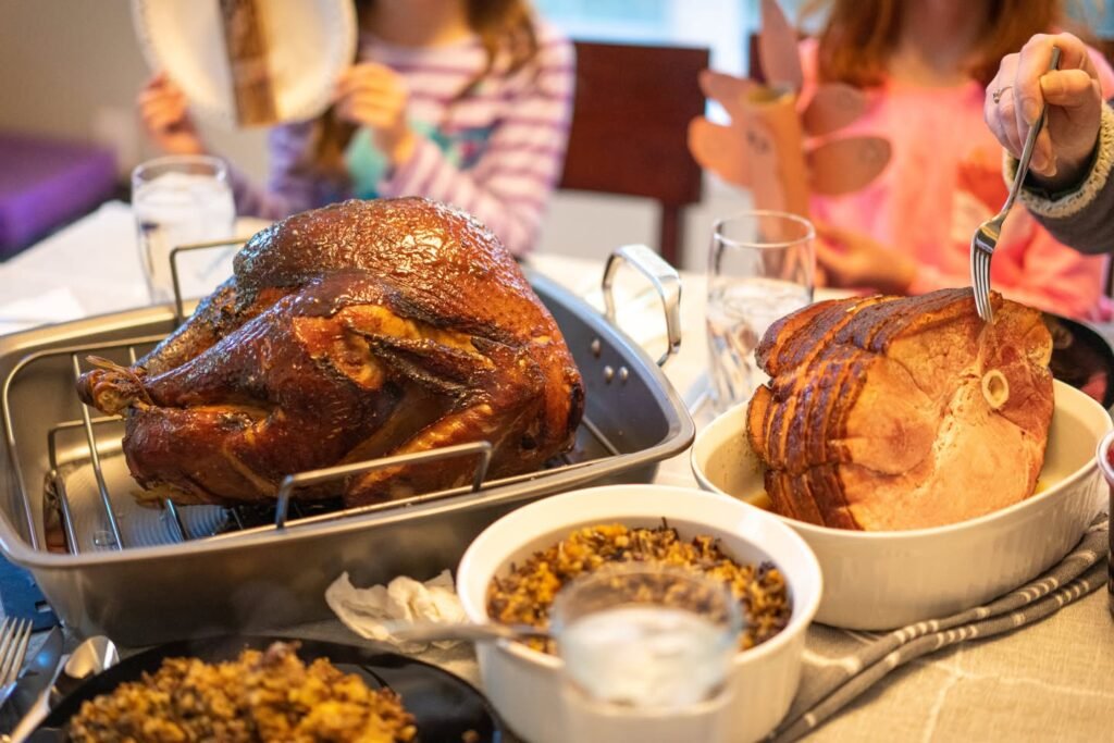 A festive holiday dinner featuring a roasted turkey and side dishes at a gathering.