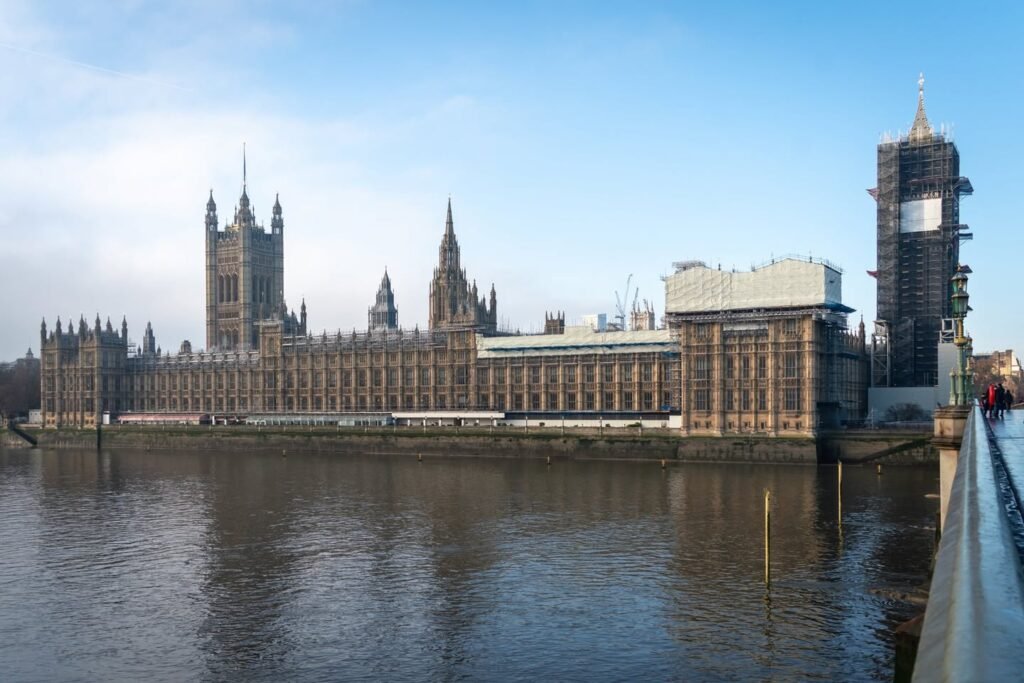 The Houses of Parliament and Big Ben viewed from across the Thames in London.