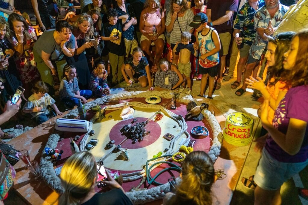 A historical reenactment or depiction of an ancient Norse ritual, with a crowd gathered around an altar-like structure adorned with offerings.