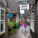 Hug Point A charming alleyway leading to Seasons Cafe in the Pacific Northwest offers beer, wine, and espresso.