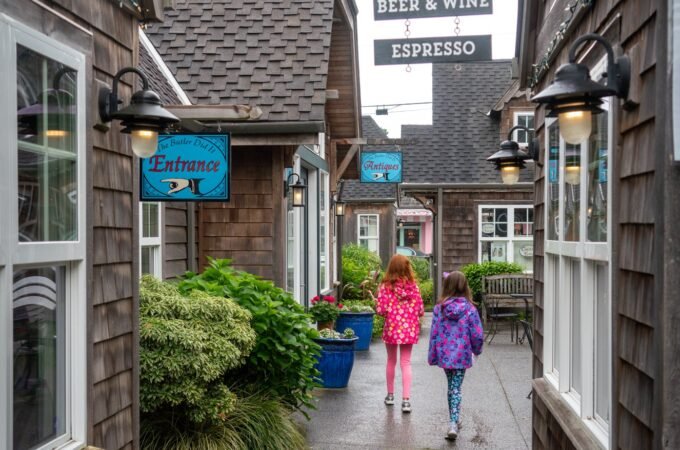 A charming alleyway leading to Seasons Cafe in the Pacific Northwest offers beer, wine, and espresso.