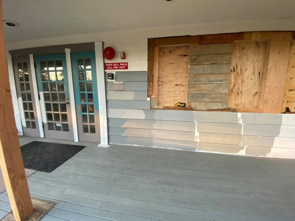 Images showing a storefront with turquoise-framed glass doors next to boarded-up sections and a gray sidewalk.