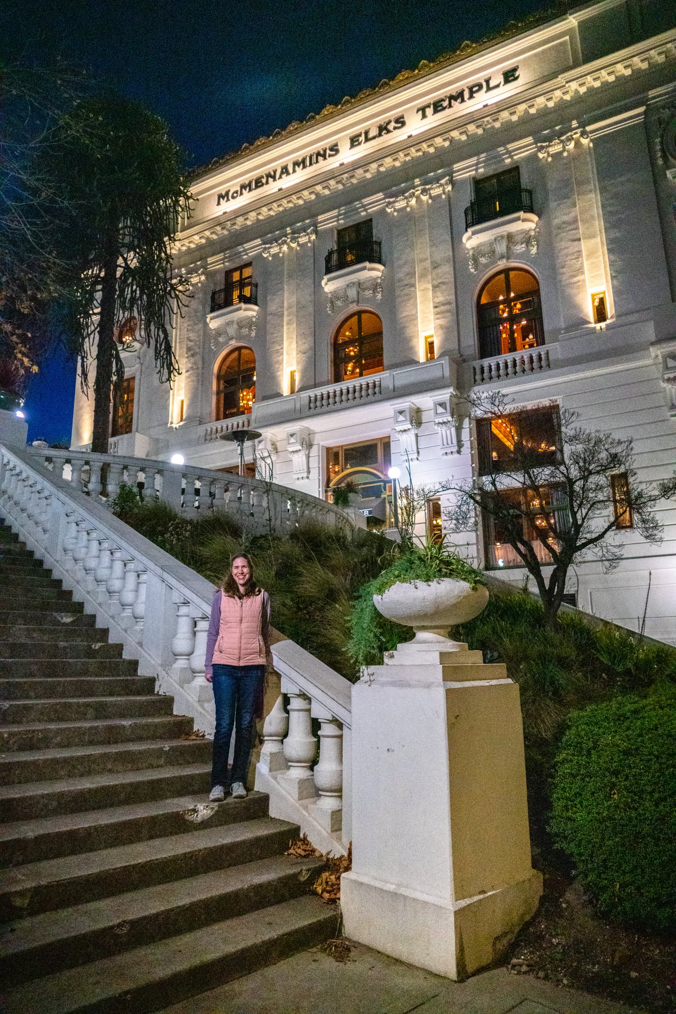19th Anniversary The Philippine General Hospital building is illuminated at dusk, with a person standing on the grand staircase.