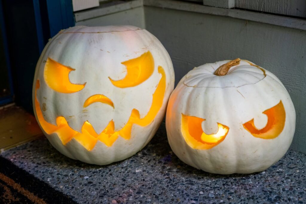 Two White Jack-O'-Lanterns on a Porch