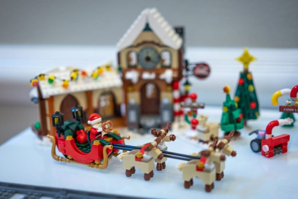 A festive holiday scene featuring a mini Christmas village with Santa and reindeer. Festive holiday scene featuring a mini Christmas village with Santa and reindeer.
