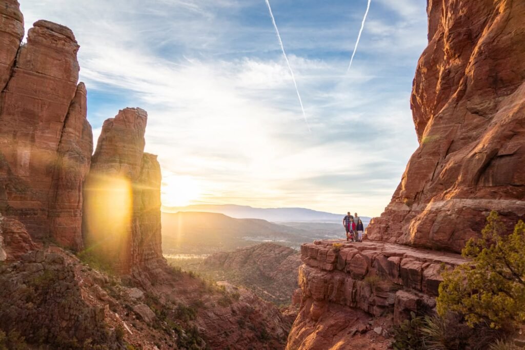A breathtaking view of the Grand Canyon at sunset with towering rock formations.