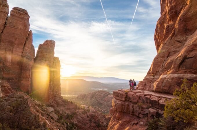 A breathtaking view of the Grand Canyon at sunset with towering rock formations.