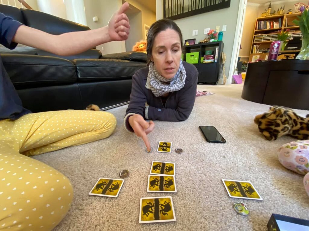 Playing Tarot Cards on a Cozy Living Room Floor