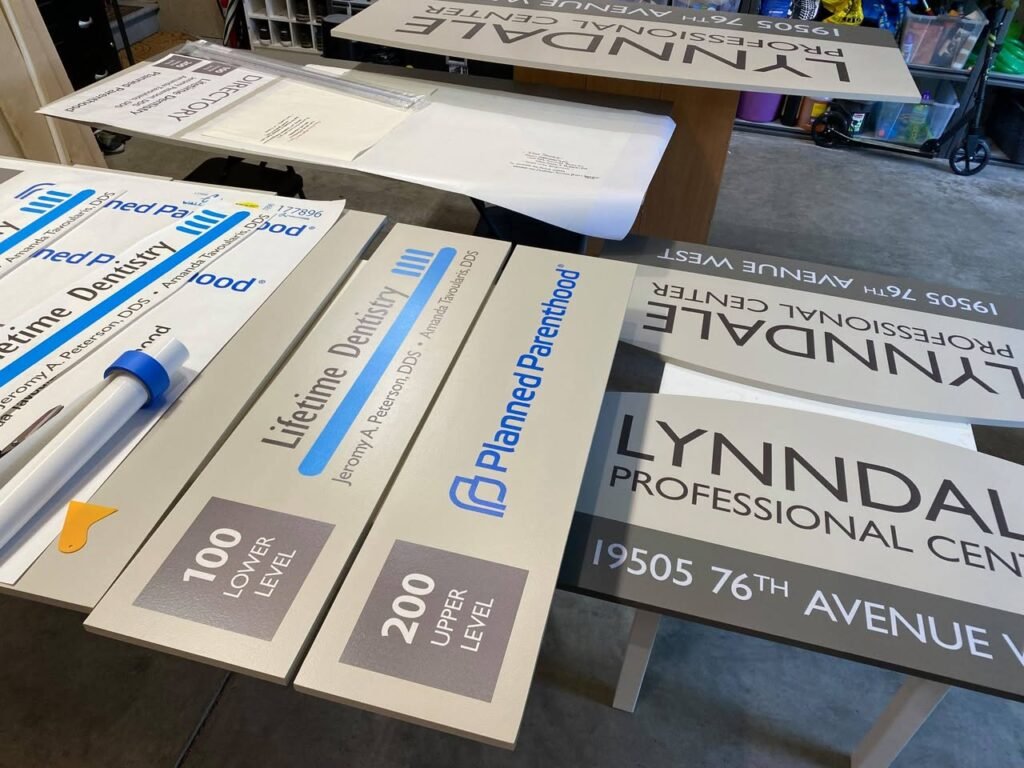 Planned Parenthood directory signage displayed prominently on a shelf at the Lynndale Professional Center at 19505 76th Avenue West.
