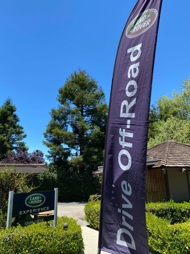 A promotional "Drive Off-Road" banner at the Land Rover Experience center.