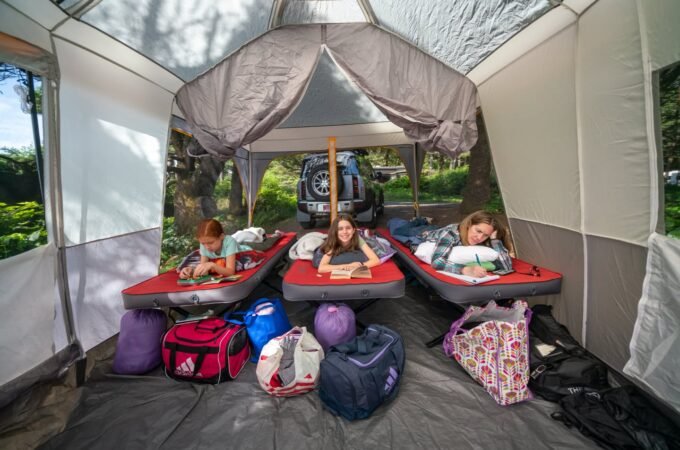 The back patio attached to our camping trailer is a good a place to work, watch rain, and shelter campfires If needed. "", "background": {"title": "Comfortable setup in our pop up rear patio of a trailer" }}