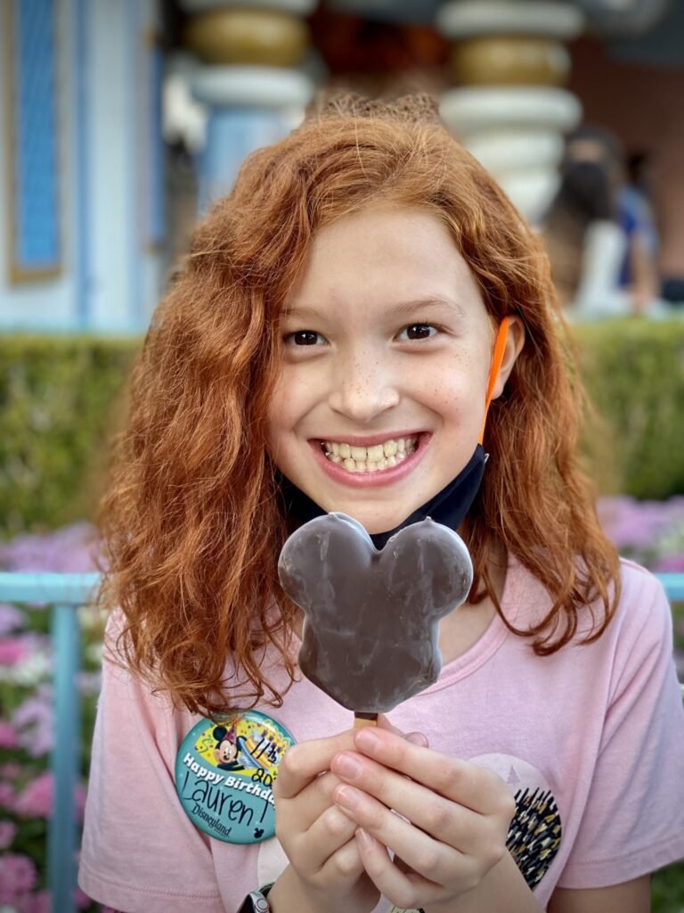 Smiling Child with Mickey Head Ice Cream