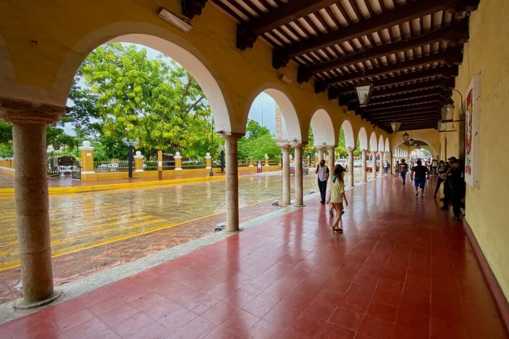 Panorama of a central plaza of Panama seen from an arched hallway in Plaza de Colombia.