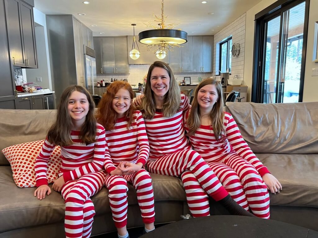 A group photo in matching red and white striped pajamas. A smaller portrait shows smiling faces.