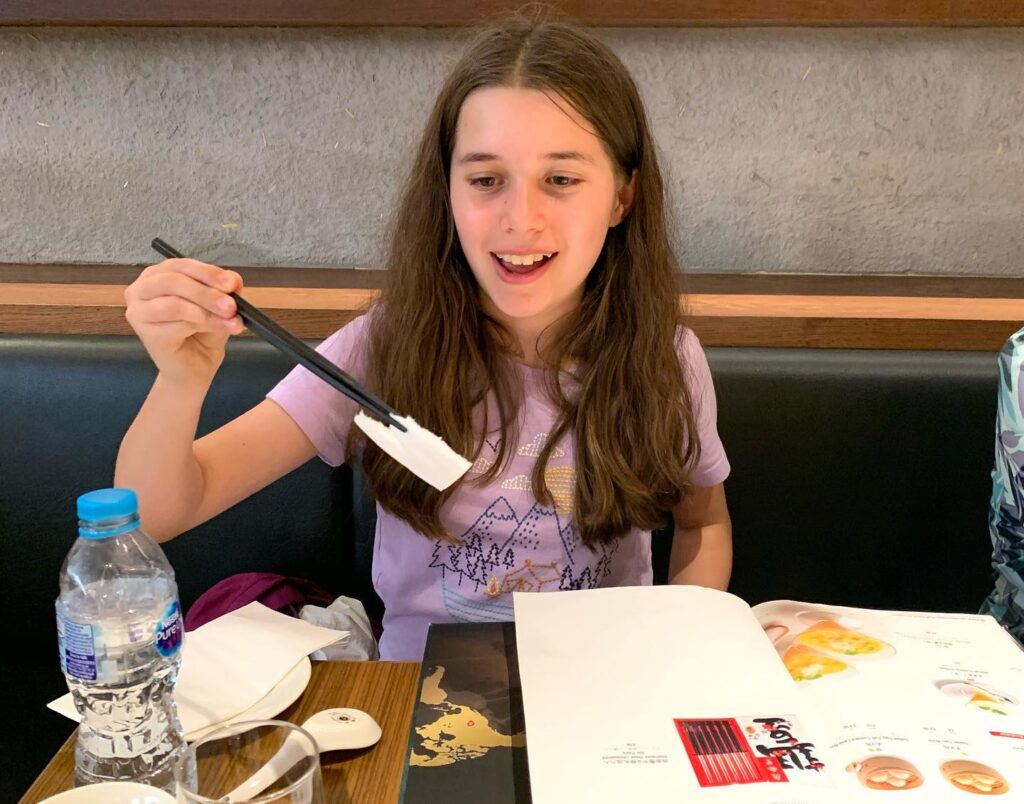 Trying New Foods at a Sushi Restaurant