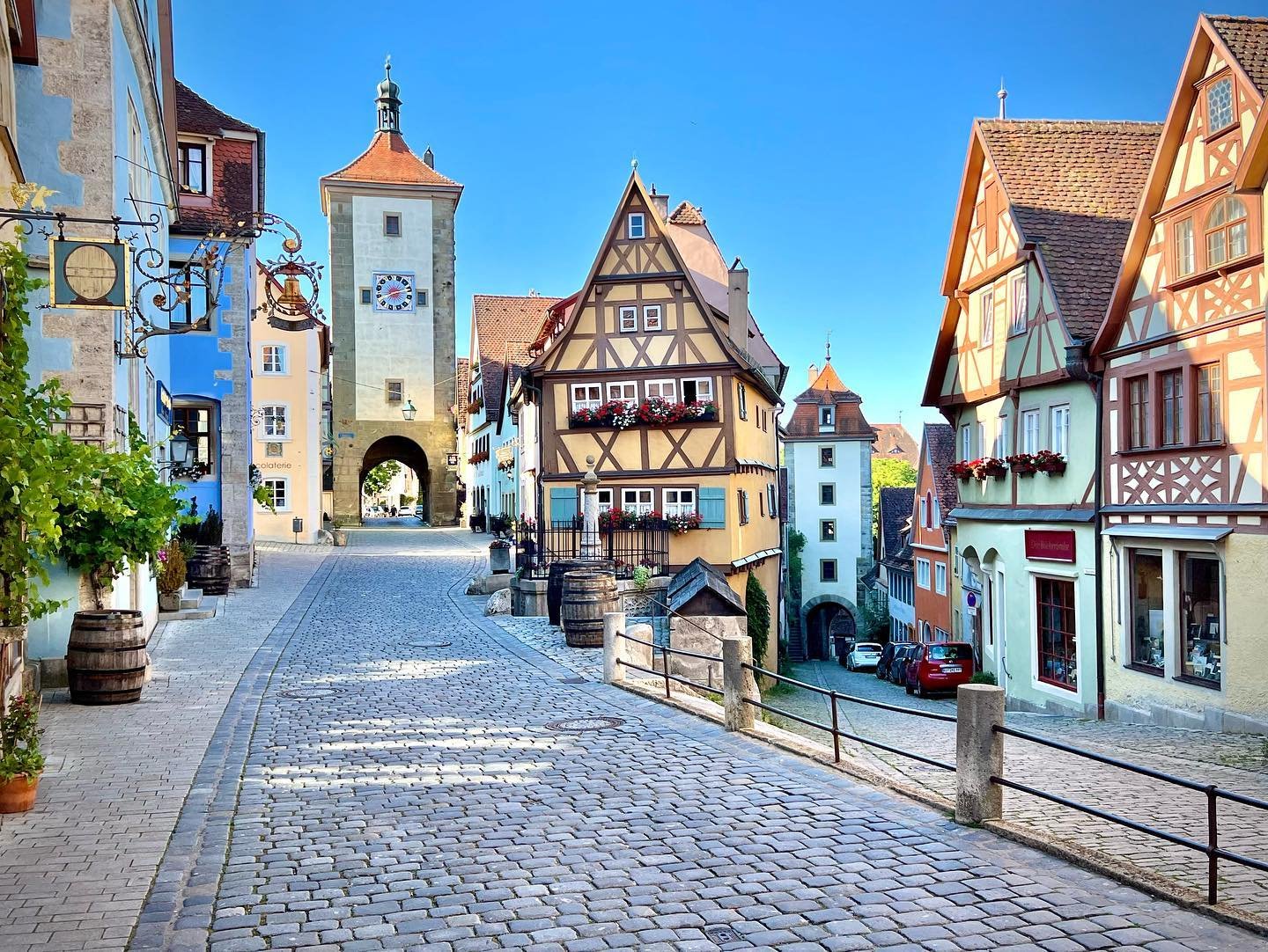 Rothenburg ob der Tauber A scenic view of traditional European architecture featuring cobblestone streets and colorful half-timbered buildings.