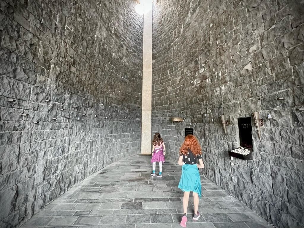 View of ancient stone corridor with high walls