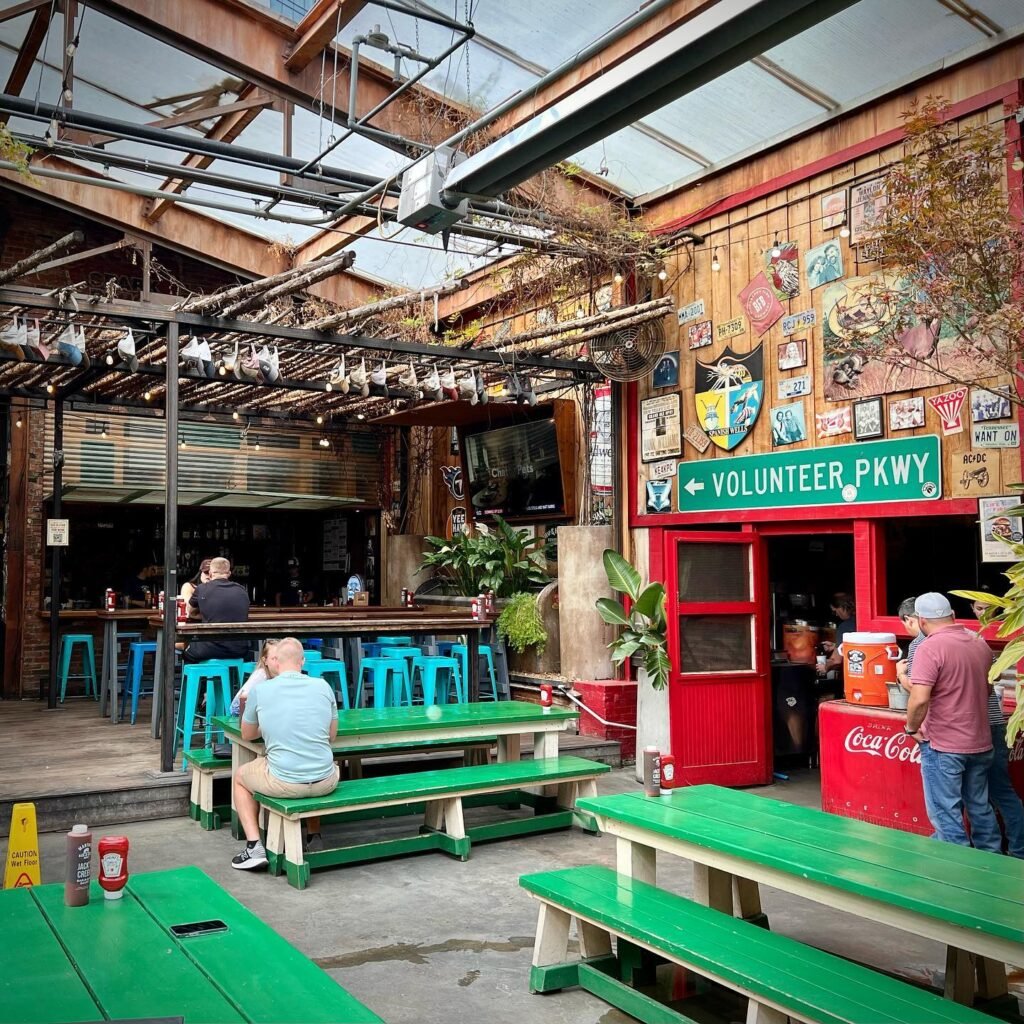 Volunteer Pkwy courtyard with green tables