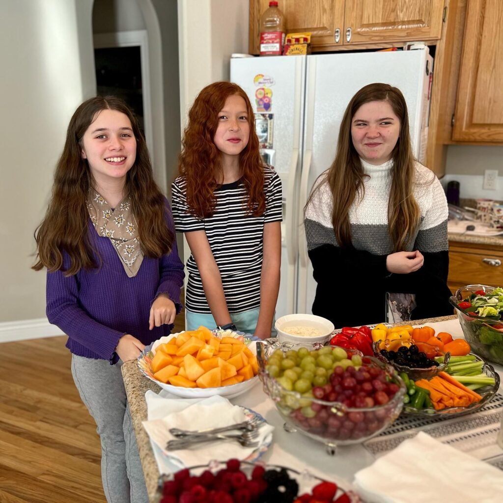 Girls Serving Fruit Platter