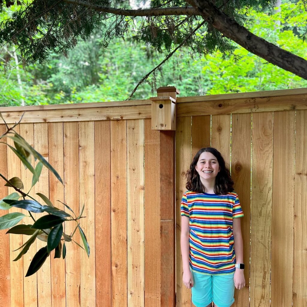 A vertical collage of photos featuring a wooden fence, a small birdhouse, lush green vegetation, and a person in a striped shirt standing outdoors.