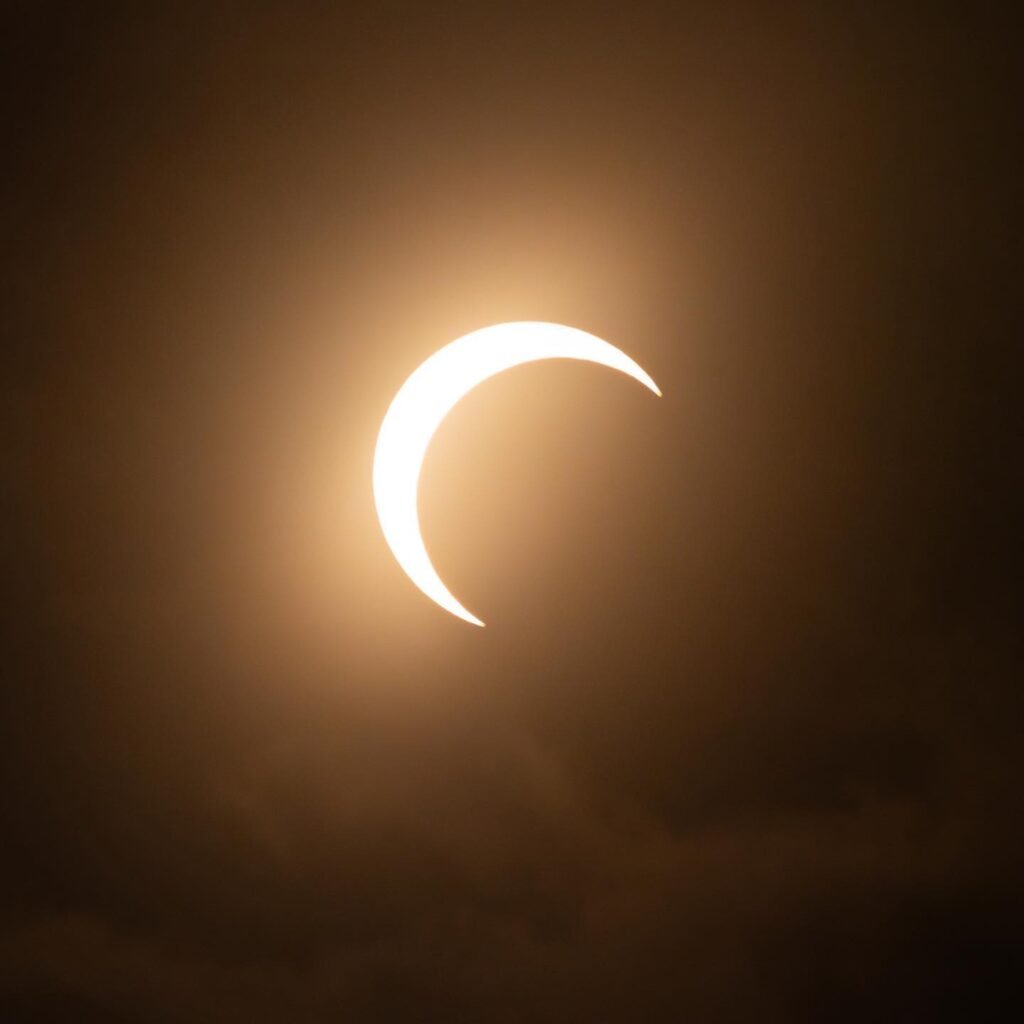 A stunning time-lapse of the 2017 solar eclipse showing the moon moving across the sun in three phases.