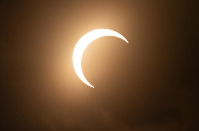 A stunning time-lapse of the 2017 solar eclipse showing the moon moving across the sun in three phases.