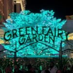 The Palazzo Resort Hotel & Casino An illuminated tree and sign spelling out Green Fairy Garden at night.