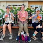 Kileaua Point National Wildife Refuge Lighthouse A family enjoys shaved ice at a Hilo, Hawaii cafe. The group shares colorful treats in a tropical setting.