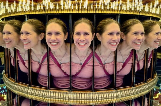 A reflection in a circular mirror array creates the illusion of multiple faces.